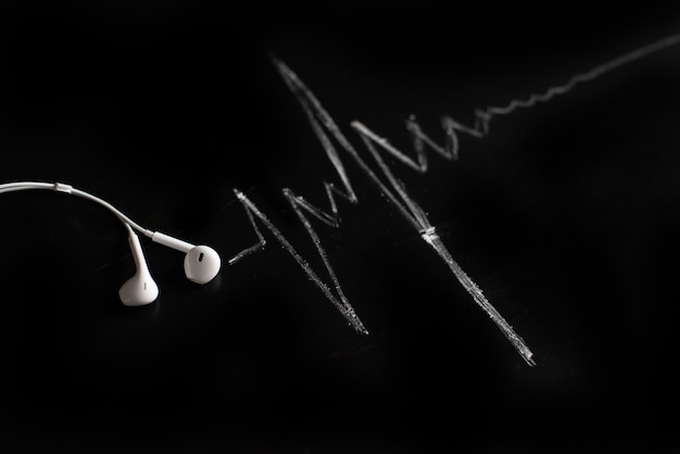 Music, pulse, heart. Black background, minimalism. 