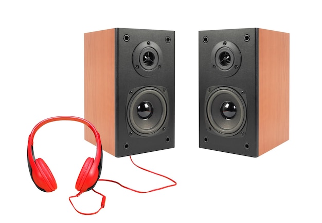 Music and sound Two black loudspeaker enclosure and red headphone Isolated