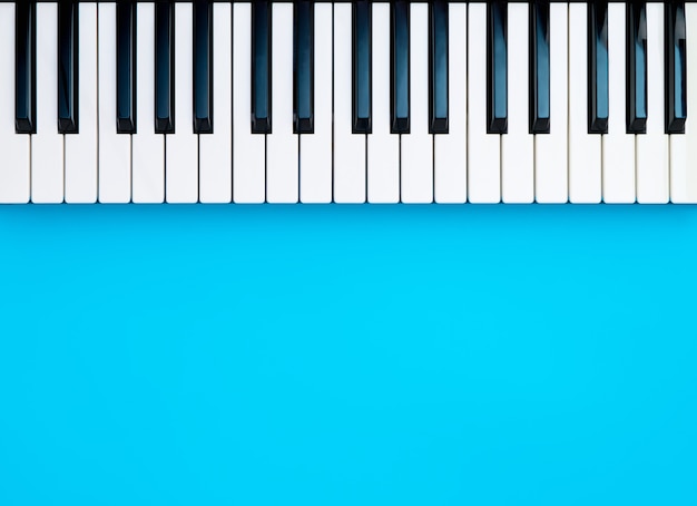 Music Synthesizer Piano Keyboard keys on blue copy space