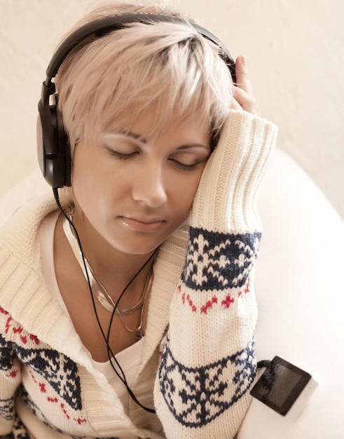 Music young blond woman with headphones