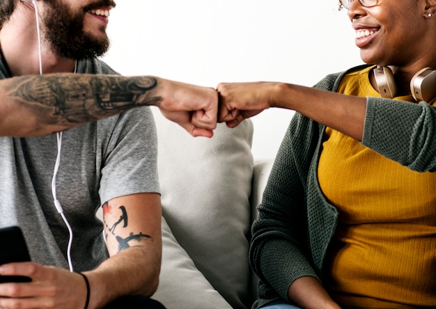 Musician couple fist bumping