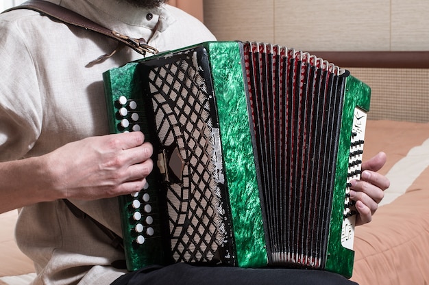 The musician playing the accordion