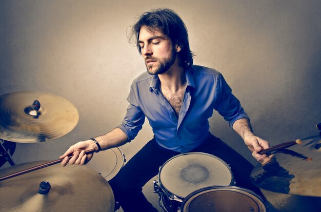 Musician playing on a drum