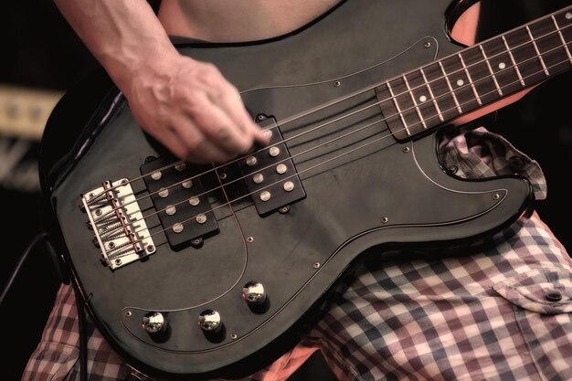 A musician playing electric guitar on concert