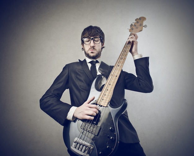 Musician playing on a guitar