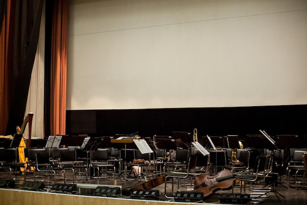 Musician plays a musical instrument on the concert stage abstract blurred image