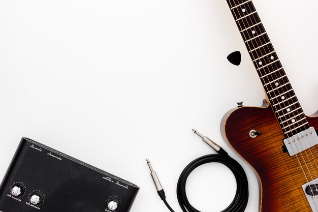 Musician work set with guitar, note and headphones