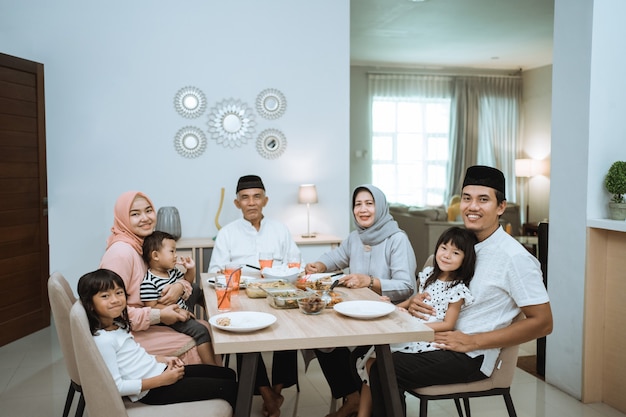 Muslim asian family and grandparents having break fasting on ramadan. iftar dinner break