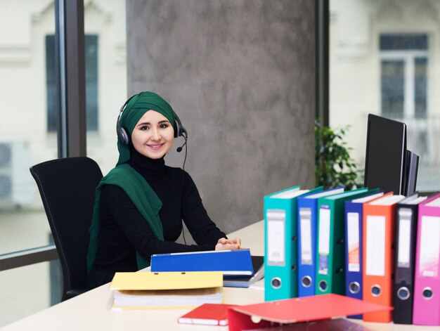 Muslim asian woman working in call center business theme