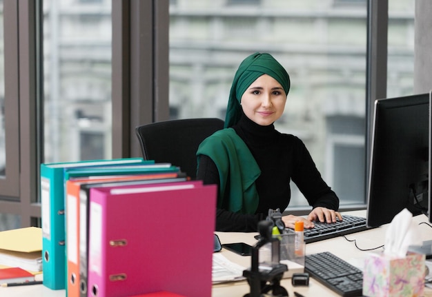 Muslim asian woman working in office. business theme