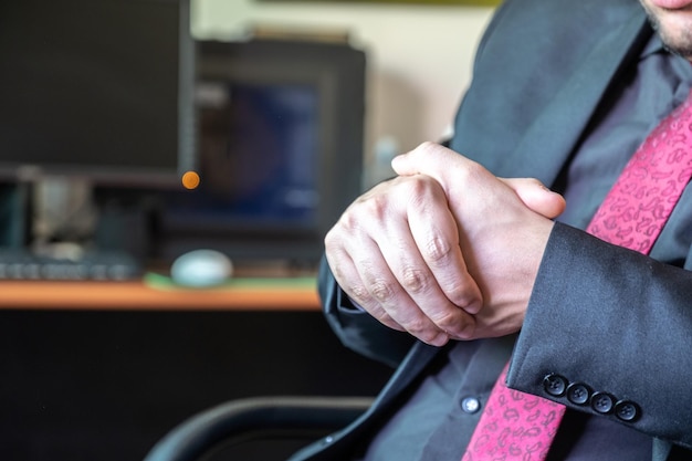 Muslim business man working in his office and cleaning his hands