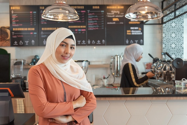 Muslim business woman open cafe shop and standing in front of countersmall business