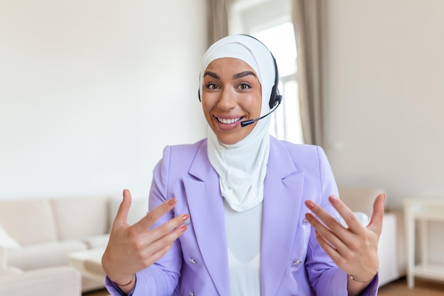 Muslim Business woman with headsets working with computer at office