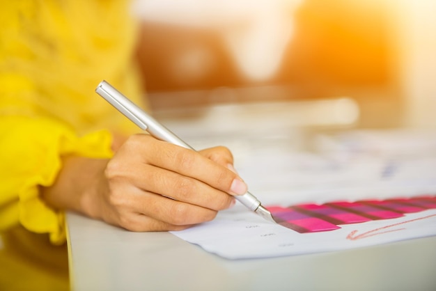 Muslim businesswomen writing and sign on the paper. Copy space for text