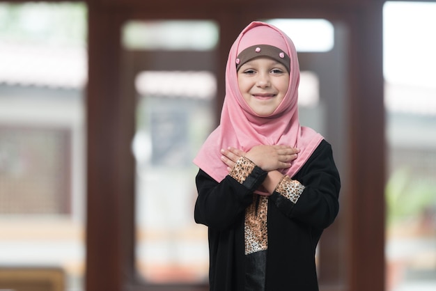 Muslim Child Praying At Mosque