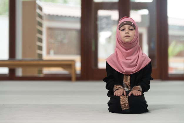 Muslim Child Praying At Mosque