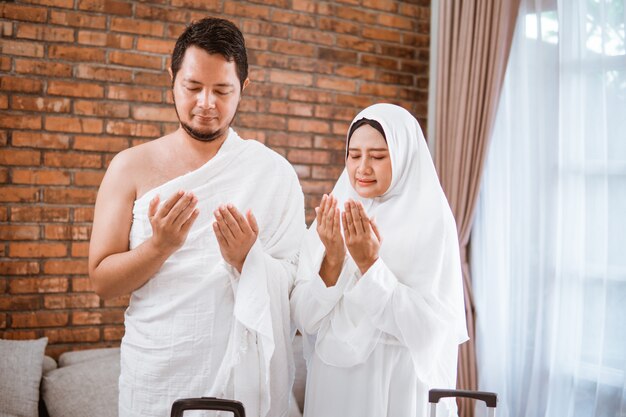 Muslim couple praying