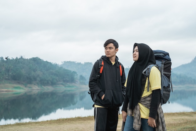 Muslim couple with backpack