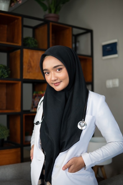 Muslim doctor working at her clinic