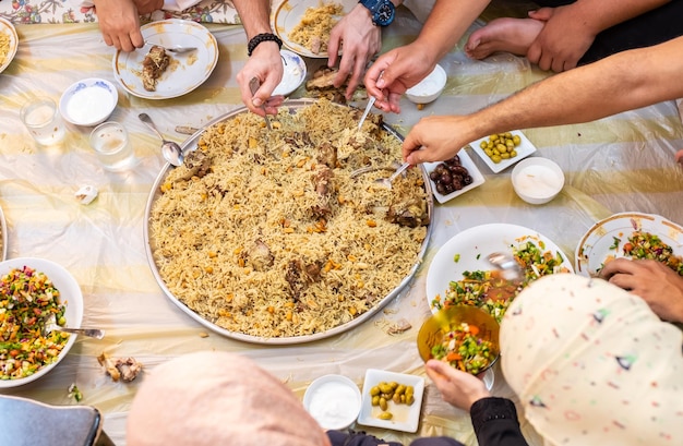 Muslim family gathering for iftar in ramadan