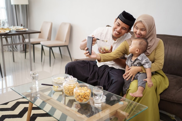 Muslim family make video phone call while dinner