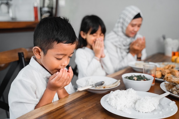 Muslim family praying