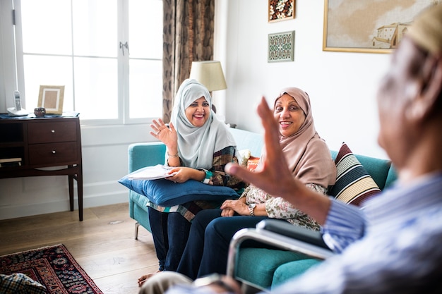 Muslim family relaxing in the home