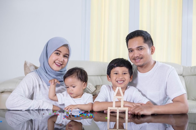 Muslim family sitting in the living room