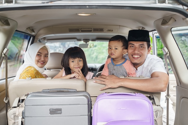 Muslim family travel by car during eid mubarak celebration 