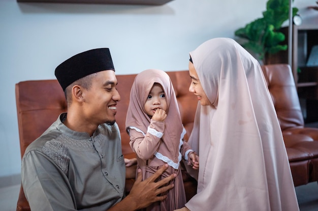 Muslim father and mother with their little girl