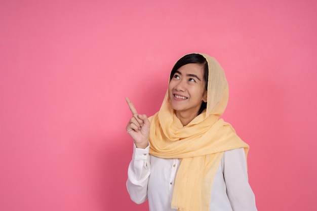 Muslim female looking up copyspace