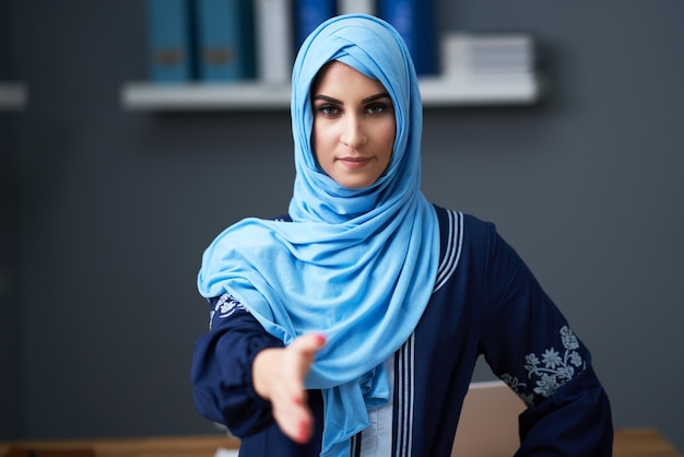 Muslim female student learning in library