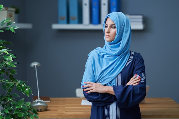 Muslim female student learning in library