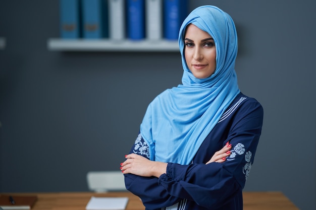 Muslim female student learning in library