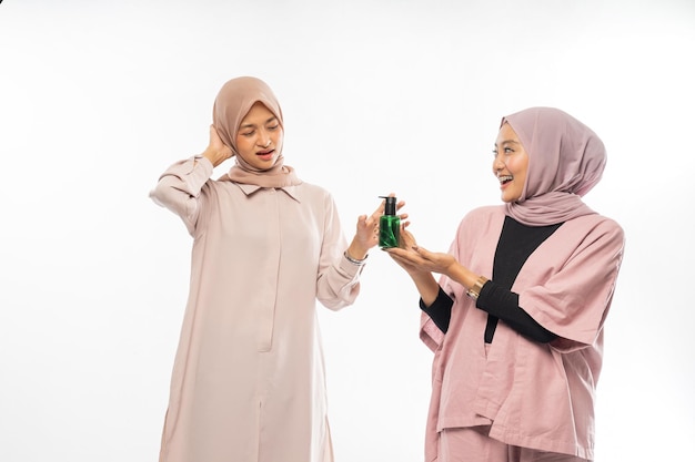 Muslim friend recommending a product to her friend