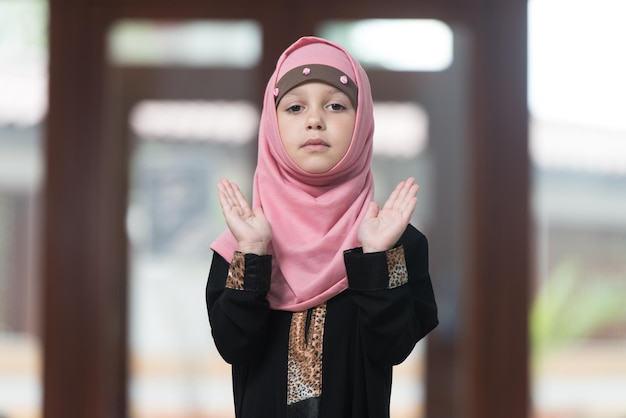 Muslim Girl Praying At Mosque