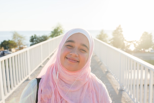 Muslim girl on sea coast