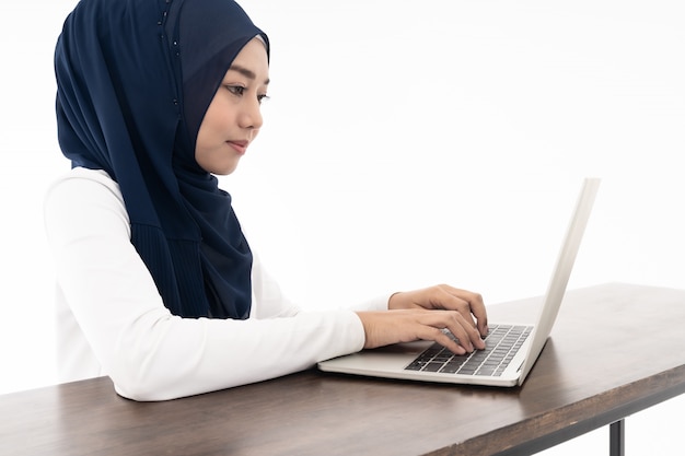 Muslim girl using laptop