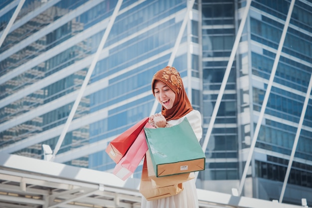 Muslim girl with shopping bag