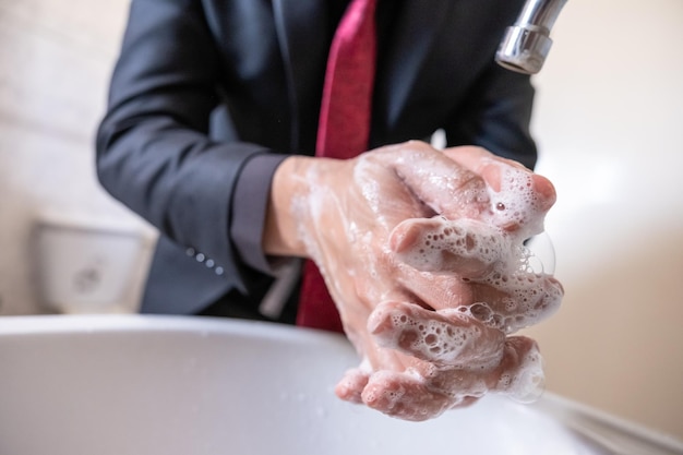 Muslim guy washing his hands