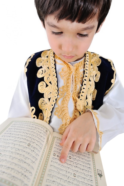 Muslim kid reading Quran