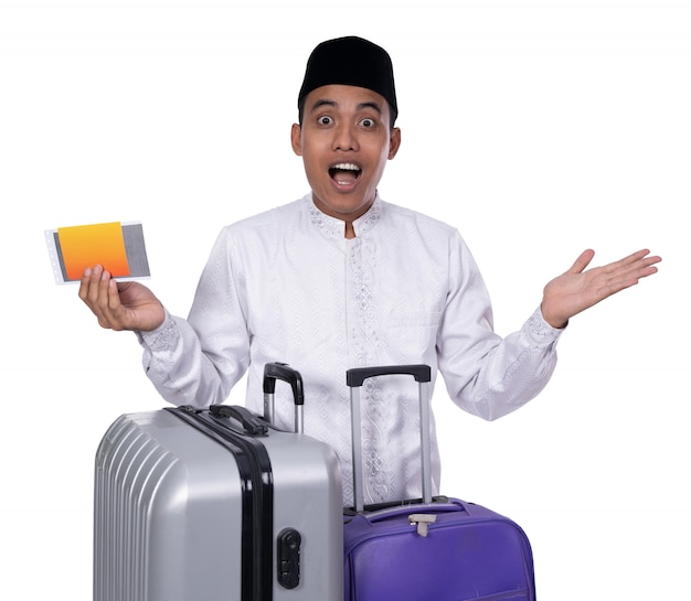 Muslim male with suitcase surprised