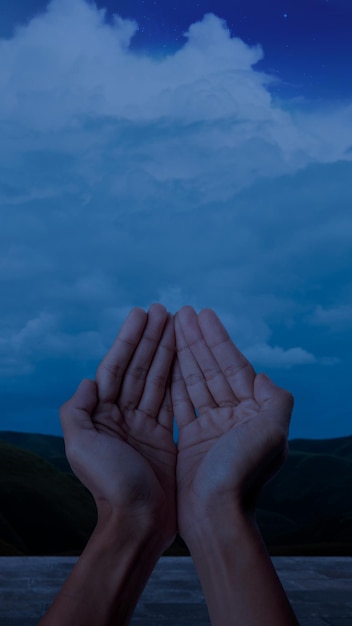 Muslim man raised hands and prayed