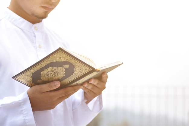 Muslim man reading holy quran islamic concept