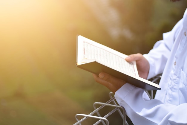 Muslim man reading holy quran islamic concept