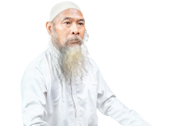 Muslim man with a beard wearing a white cap