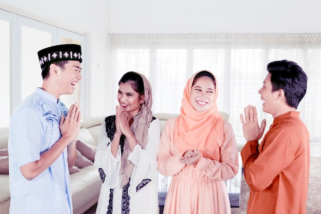 Muslim people greeting to each other at home