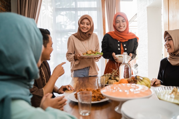 Muslim people having some food together