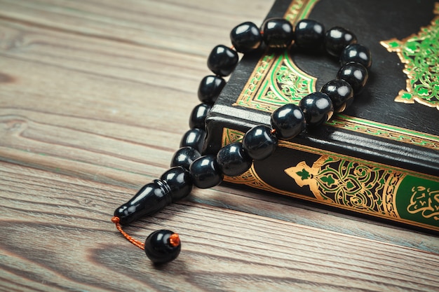 Muslim prayer beads on wood