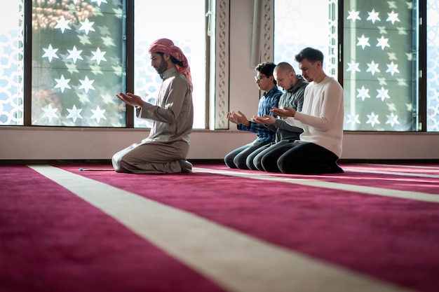 Muslim praying inside beautiful mosque